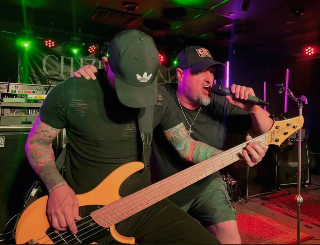 Citizen Kane singer and bassist performing